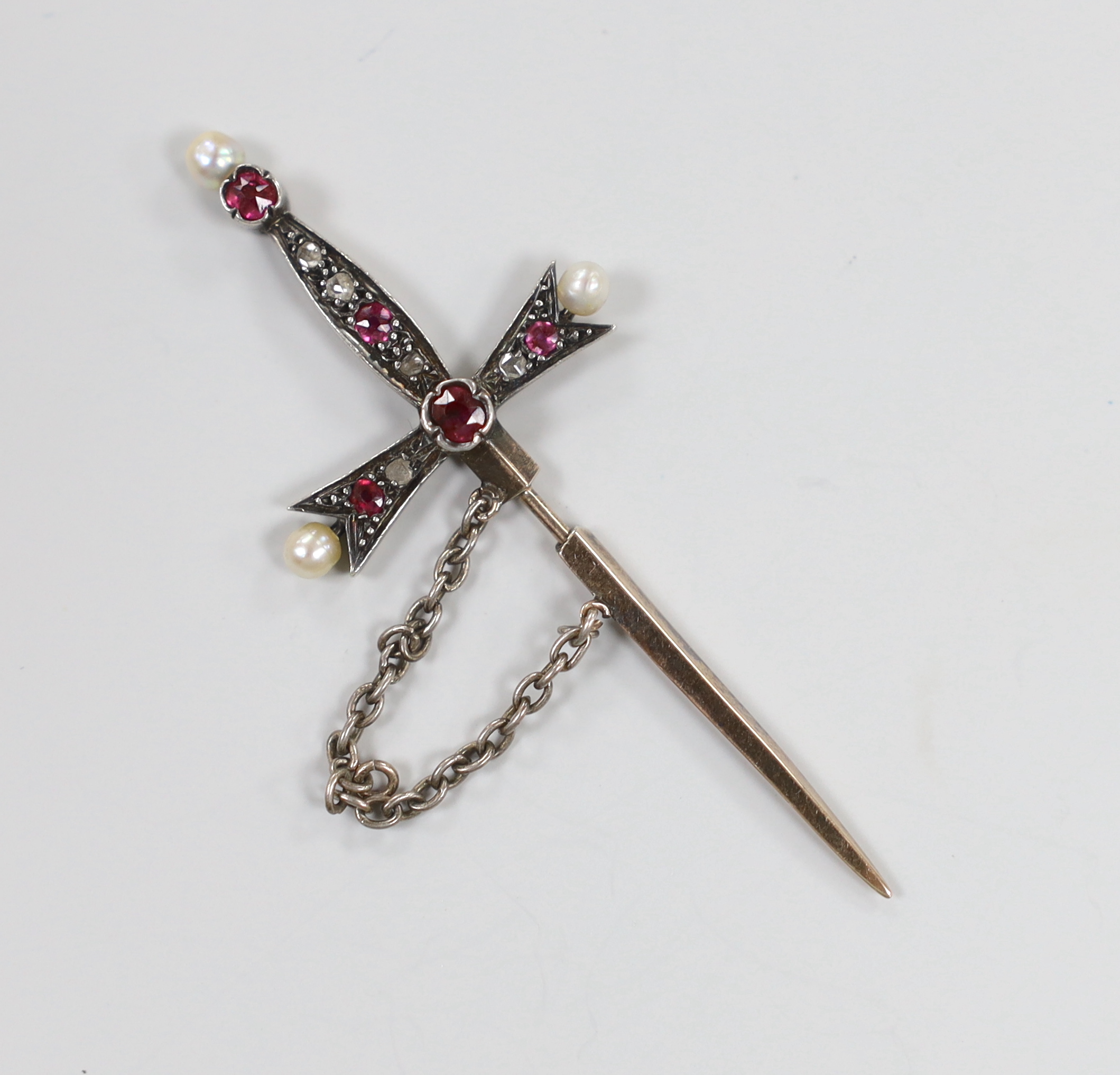 An Edwardian yellow and white metal, rose cut diamond, seed pearl and ruby? set 'sword and scabbard' jabot pin, 58mm, gross weight 3.3 grams.